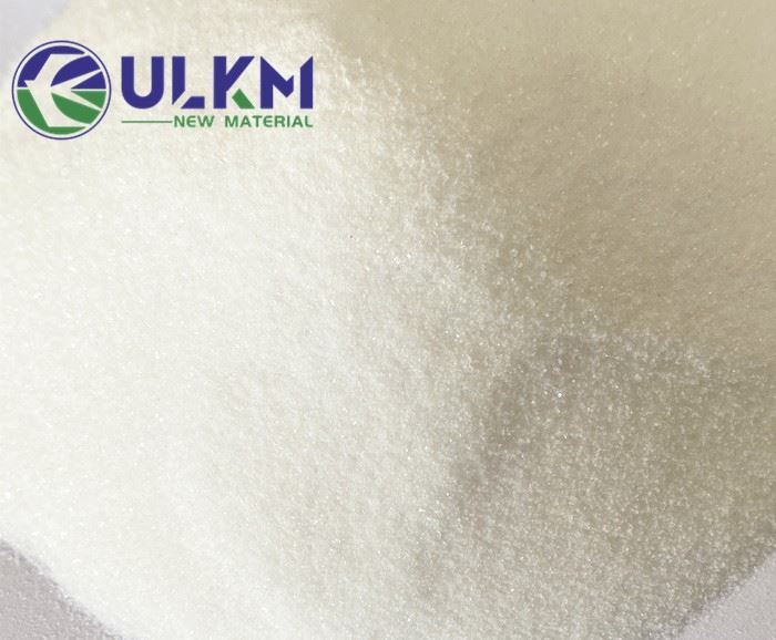Macro photograph of pharmaceutical-grade polyvinylpyrrolidone K30 (PVP K30) white free-flowing powder, showing fine particle morphology and uniform appearance under bright